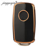 A black TPU silicone car key case with a round metallic accent, designed for VW, Skoda, and Seat flip keys.