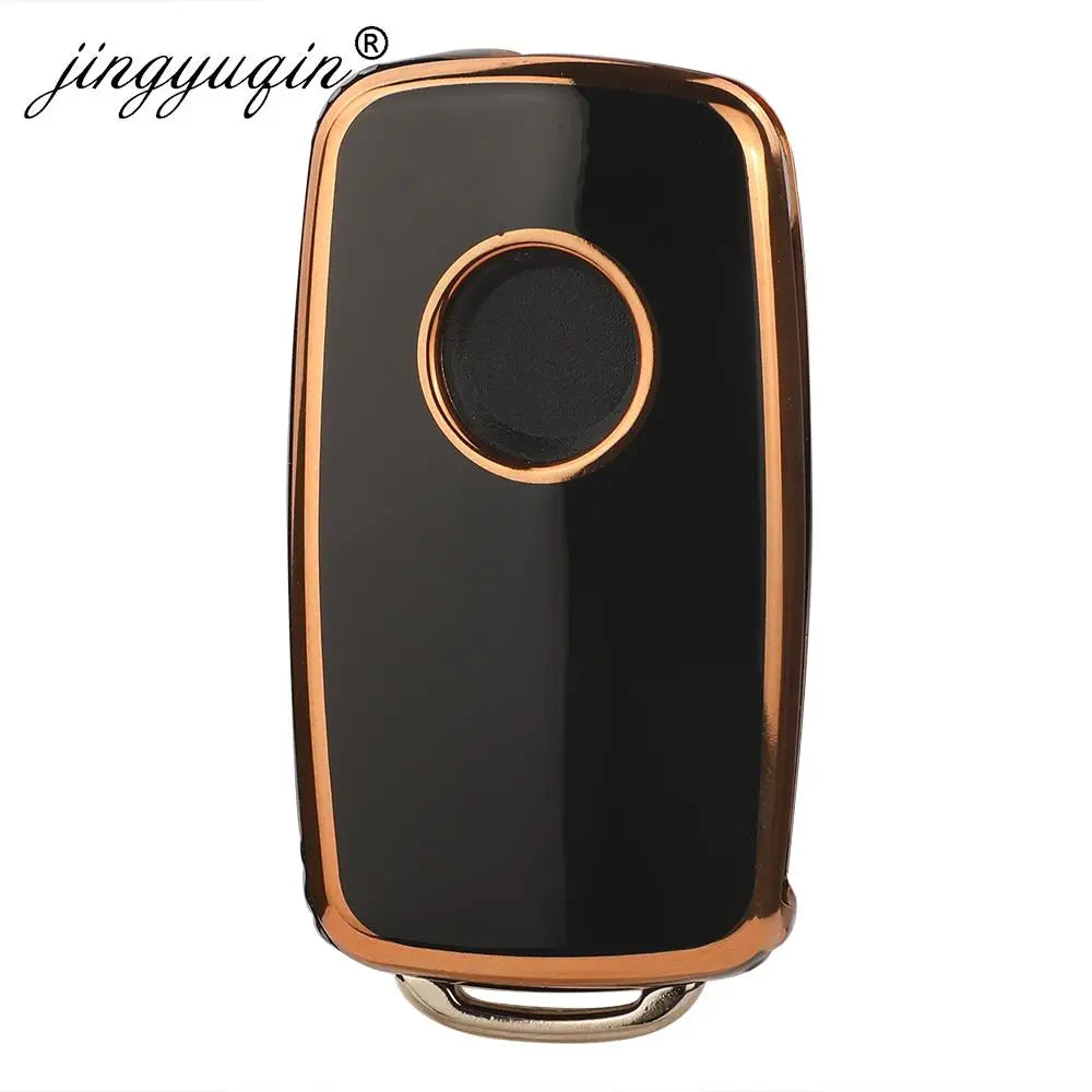 A black TPU silicone car key case with a round metallic accent, designed for VW, Skoda, and Seat flip keys.