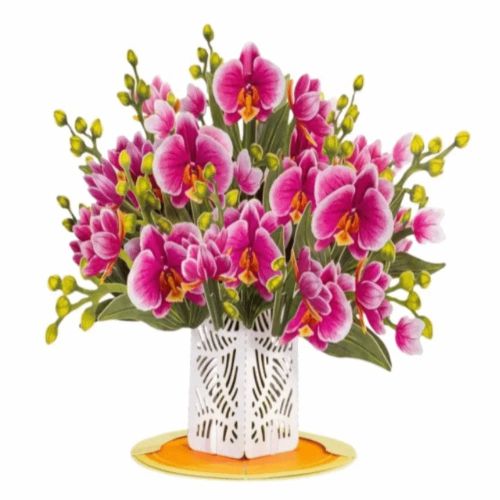 A bouquet of vibrant pink and magenta orchid flowers displayed in a white decorative vase.