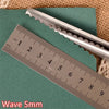A silver pinking shear is shown next to a ruler measuring 9 cm, with the text Wave 5mm visible.