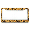 A rectangular license plate frame with a leopard print design, featuring a gold-toned border and mounting tabs.