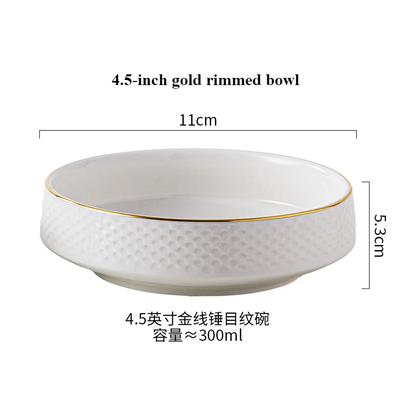 A white ceramic bowl with a gold rim, measuring 4.5 inches and holding about 300ml.
