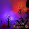 An LED Halloween birch tree with orange and purple lights is displayed in a dark room setting.