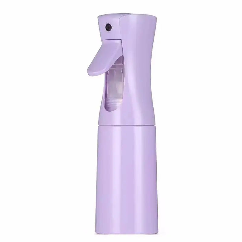 A purple refillable mist spray bottle with a hinged cap, designed for hair, skin, and home use.