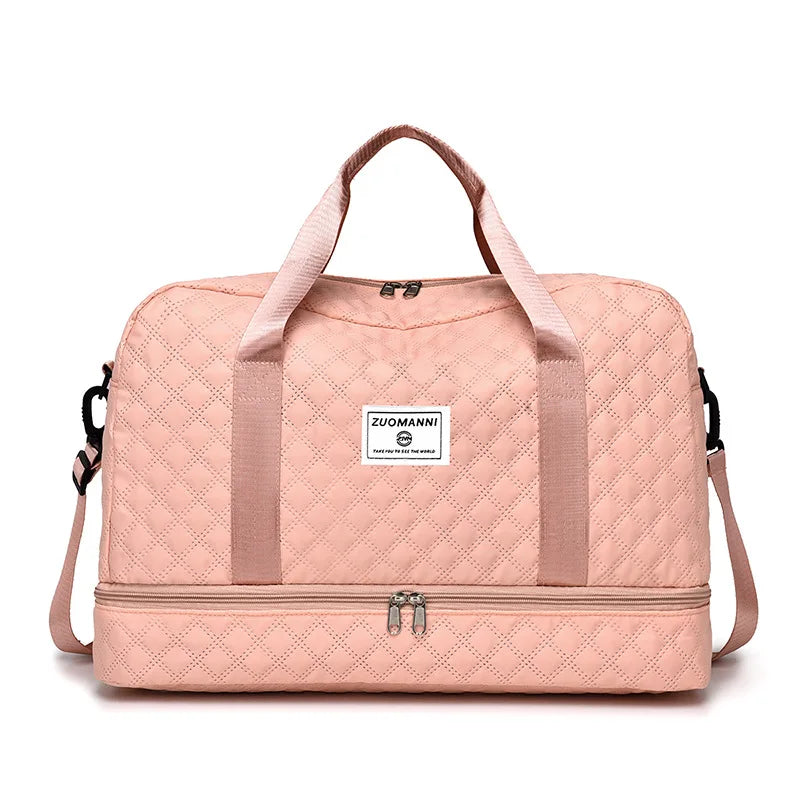 A light pink Zuomanni lightweight nylon travel duffle bag with padded straps.
