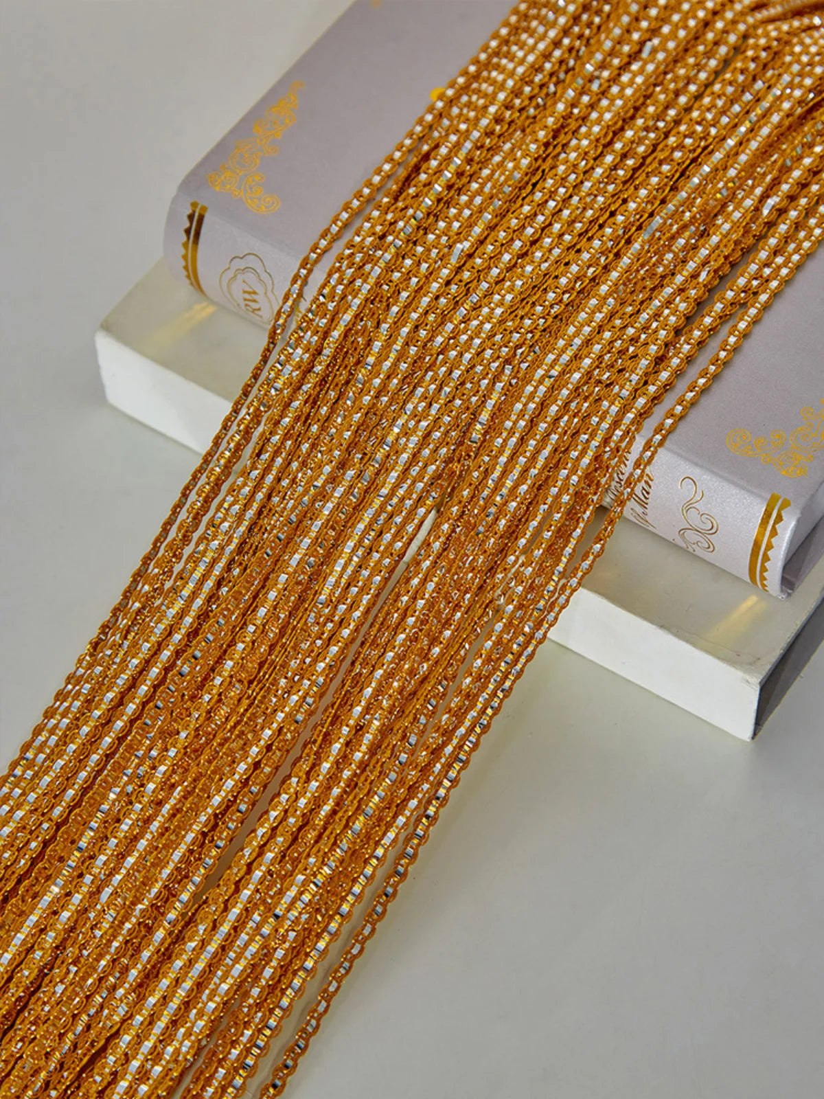Golden and white tassel string curtain for doorways and room dividers