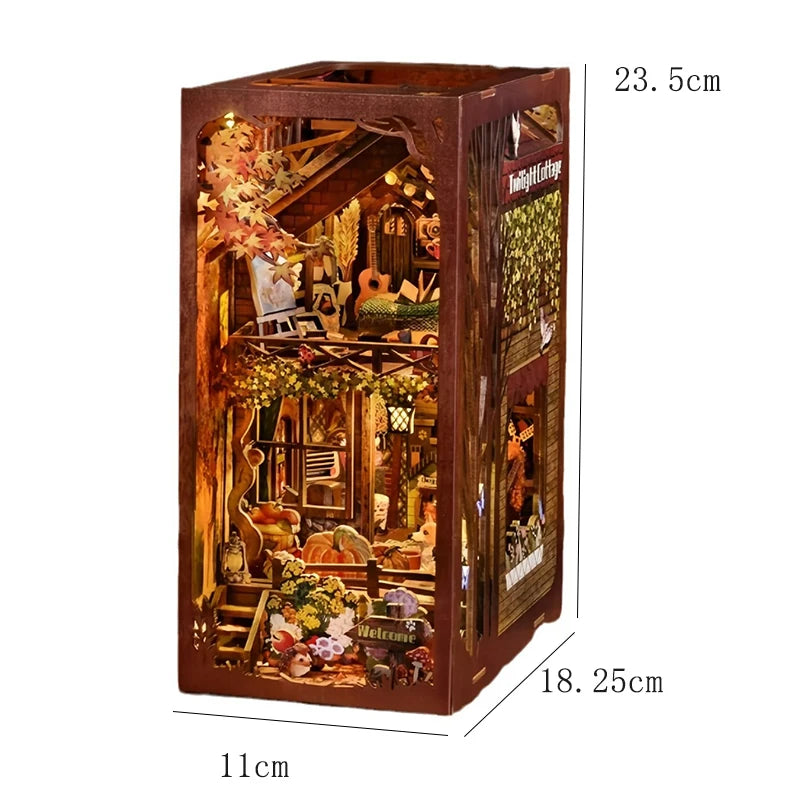 A wooden DIY book nook kit featuring a detailed miniature house scene with foliage and interior decor.