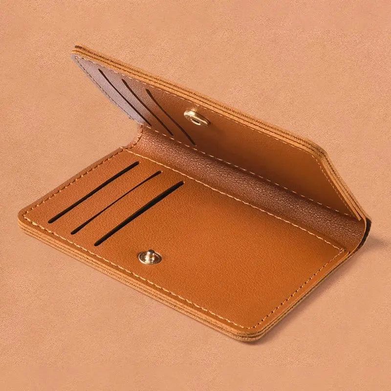 A tan ultra-thin PU leather compact wallet shown open, displaying a smooth leather interior and protective cover.