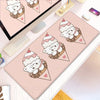 A pink Kawaii cartoon themed gaming desk mat featuring multiple illustrations of fluffy white ice cream cones.
