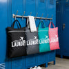 A row of blue laundry cabinets displaying various colored fabric laundry bags.