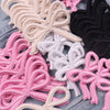 Assortment of pink, black, and white embroidered bow iron-on patches for DIY clothing decoration