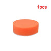 One orange self-adhesive polishing pad for car detailing.
