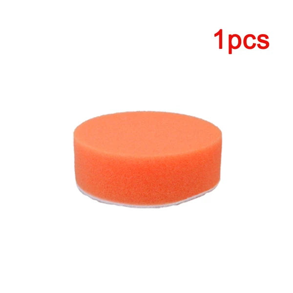 One orange self-adhesive polishing pad for car detailing.