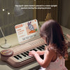 A young child is playing a 37-key electronic piano with a microphone, demonstrating how matching music score helps babies get