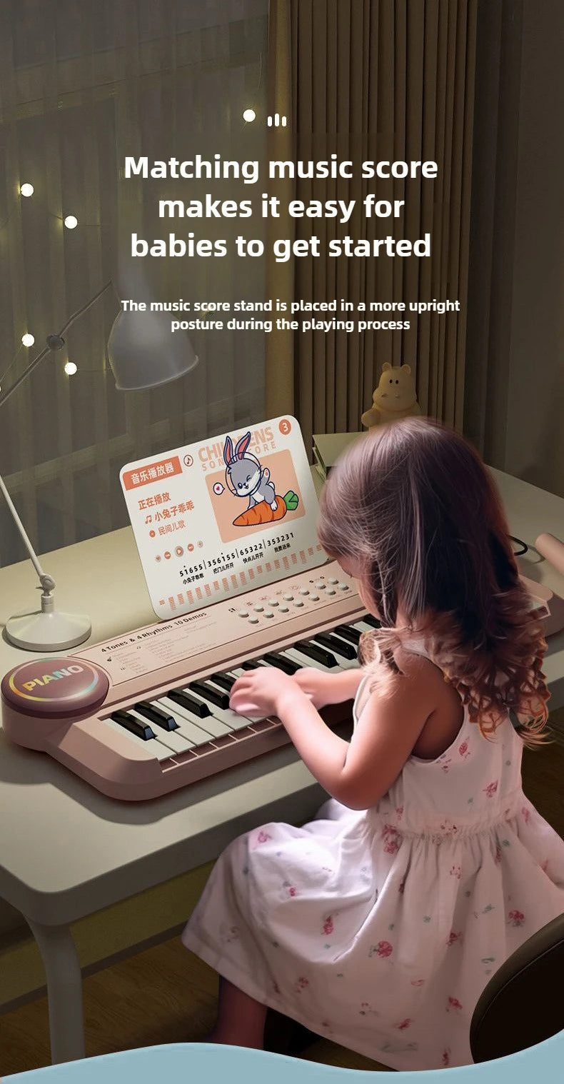 A young child is playing a 37-key electronic piano with a microphone, demonstrating how matching music score helps babies get