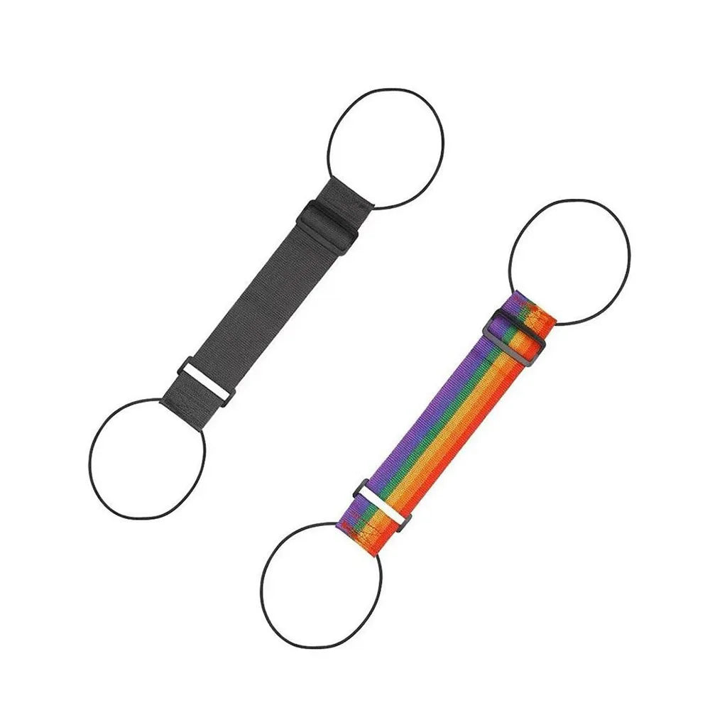 Adjustable luggage strap with a quick-release buckle featuring a rainbow color pattern.