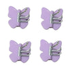 Un juego de ganchos decorativos de mariposa giratoria morados para la pared.