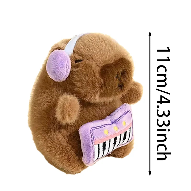 A brown capybara plush toy with a white headband and a purple guitar accessory, shown against a white background.