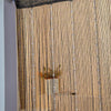 A close-up of a crystal beaded string curtain in a gold tone hanging vertically.