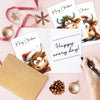 A set of adorable Highland cow Christmas cards and envelopes with festive holiday decorations