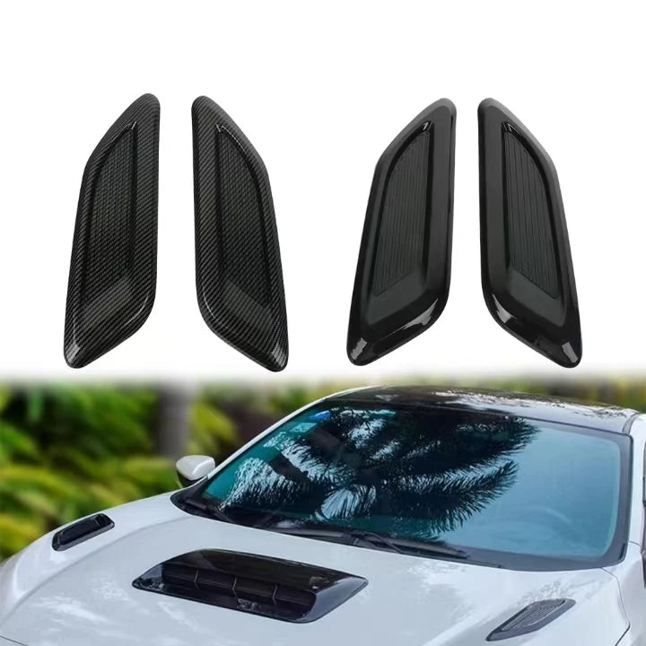 Black decorative hood scoop covers for a car air intake vent