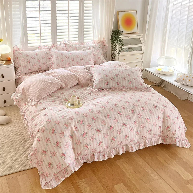 Pink floral ruffle cotton duvet cover set displayed on a bed with white window blinds and light wood flooring.