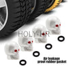 A set of four white skull design rubber gaskets used as air leakage proof valve stem caps for tires.