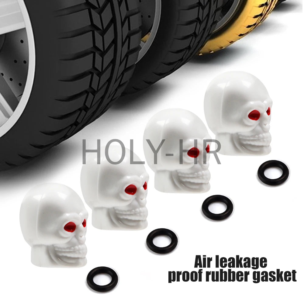A set of four white skull design rubber gaskets used as air leakage proof valve stem caps for tires.