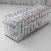 A clear jewelry organizer box with multiple secure compartments for storing rings and other small items.