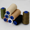 A collection of spools of heavy-duty waterproof bonded polyester thread in various colors including olive green, beige, and b