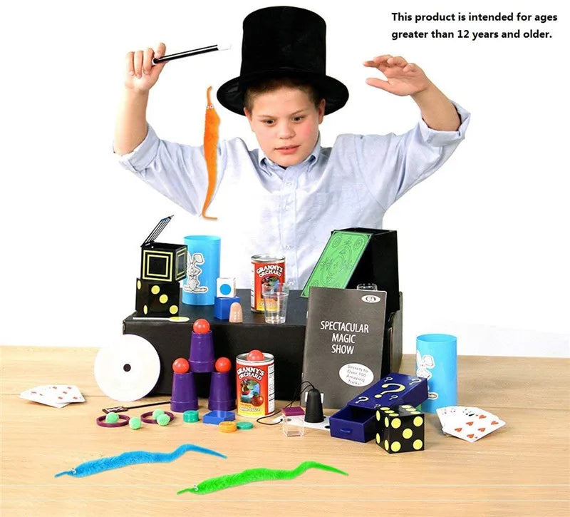 A child performs a magic trick using a fuzzy wiggly worm and an invisible string on a wooden table.