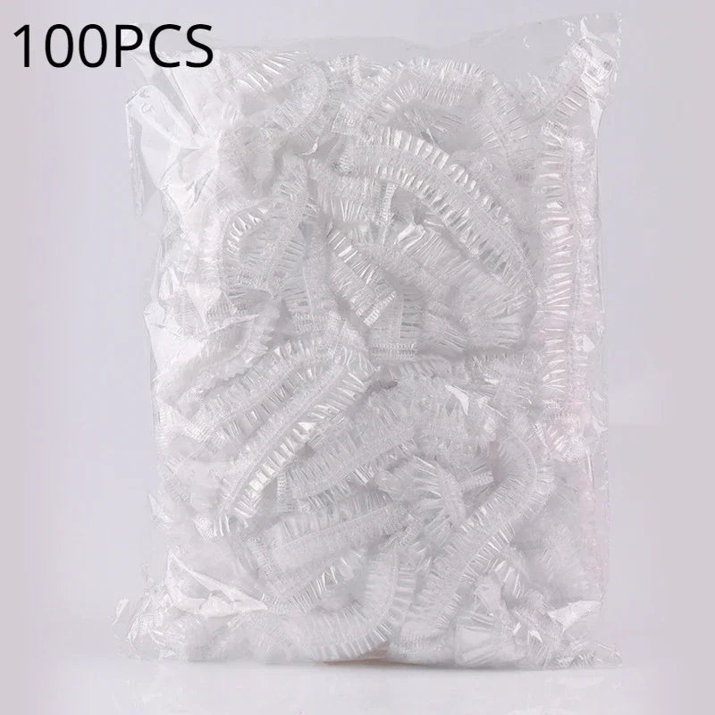 A bag containing 100 pieces of disposable transparent waterproof shower caps.