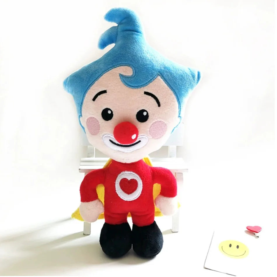 A soft plush toy of a blue-haired clown with a red nose and a red shirt.