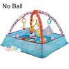 A baby play gym mat featuring an orange arch and colorful hanging toys for infant activity.