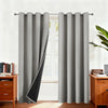Gray double-layer blackout curtains hanging in a window frame with natural light.