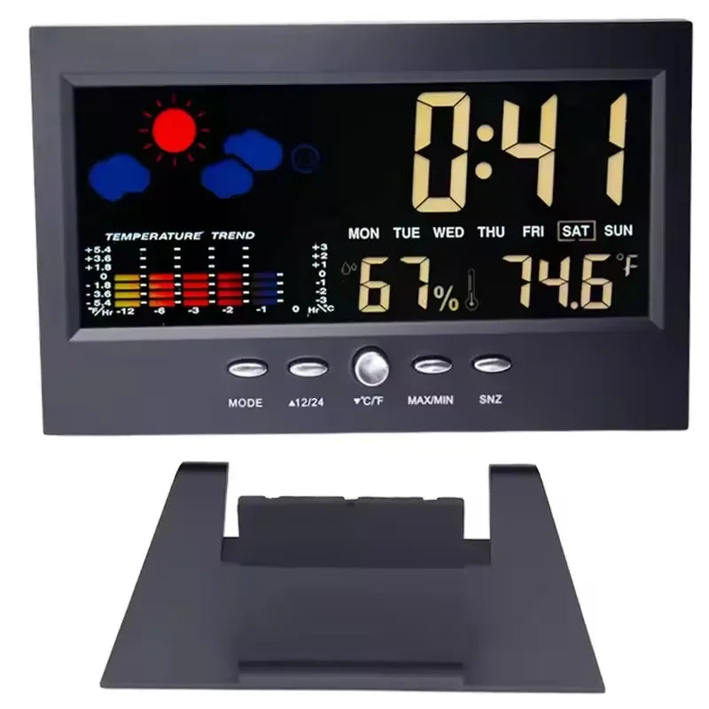 A digital weather station clock displaying time, temperature, and humidity with a black display and a dark gray mounting brac