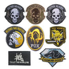 A collection of embroidered patches featuring skulls, a fox head, and a dog head design.