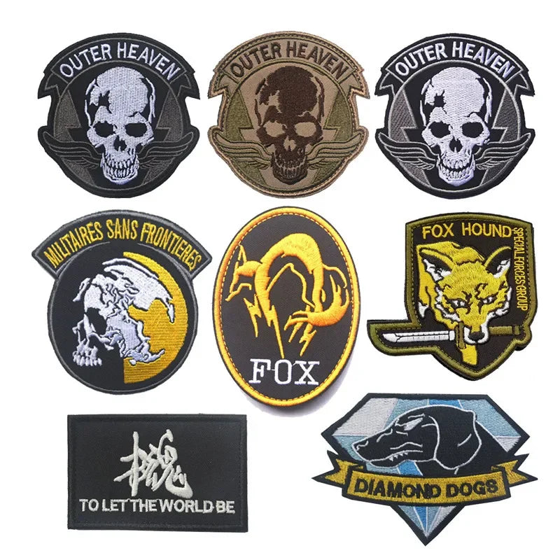 A collection of embroidered patches featuring skulls, a fox head, and a dog head design.