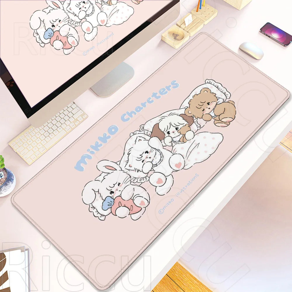 A pink kawaii cartoon desk mat featuring fluffy white rabbits and a brown bear character.