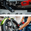 A hand uses a red cordless right angle ratchet wrench with a brushless motor to work on a bicycle wheel.