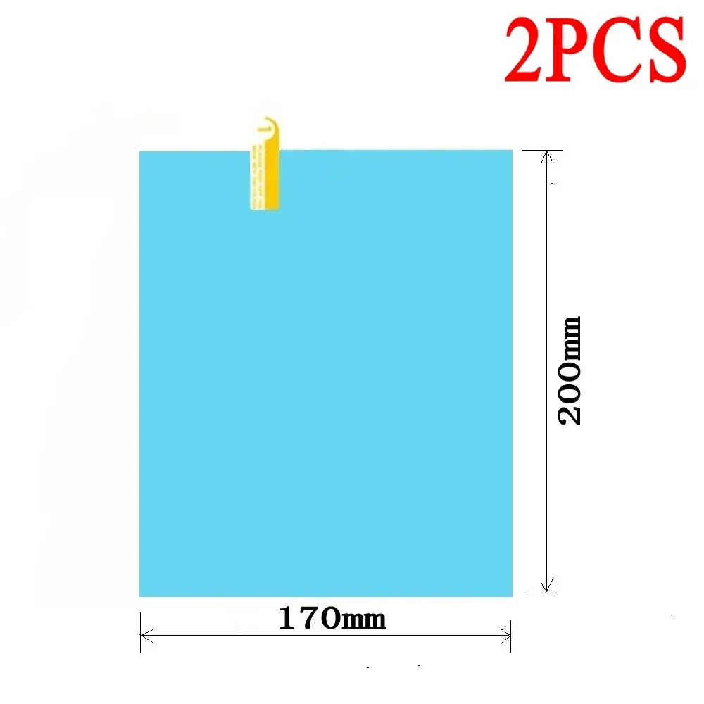 Two pieces of clear anti-fog and rain-repellent film for a car mirror.