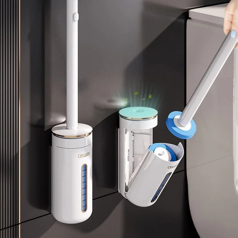 A wall-mounted disposable toilet brush set with a white handle and blue refill heads is shown against a dark gray wall.