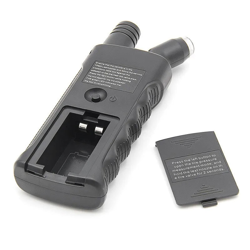 A black TPMS relearn tool with a digital tire pressure gauge is shown on a white background.