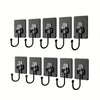 A set of black adhesive hooks for kitchen, bathroom, and storage use