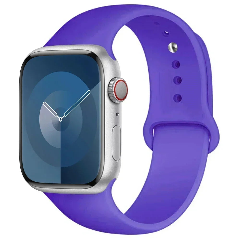A purple silicone sport band is shown next to an Apple Watch, highlighting the watch and strap.