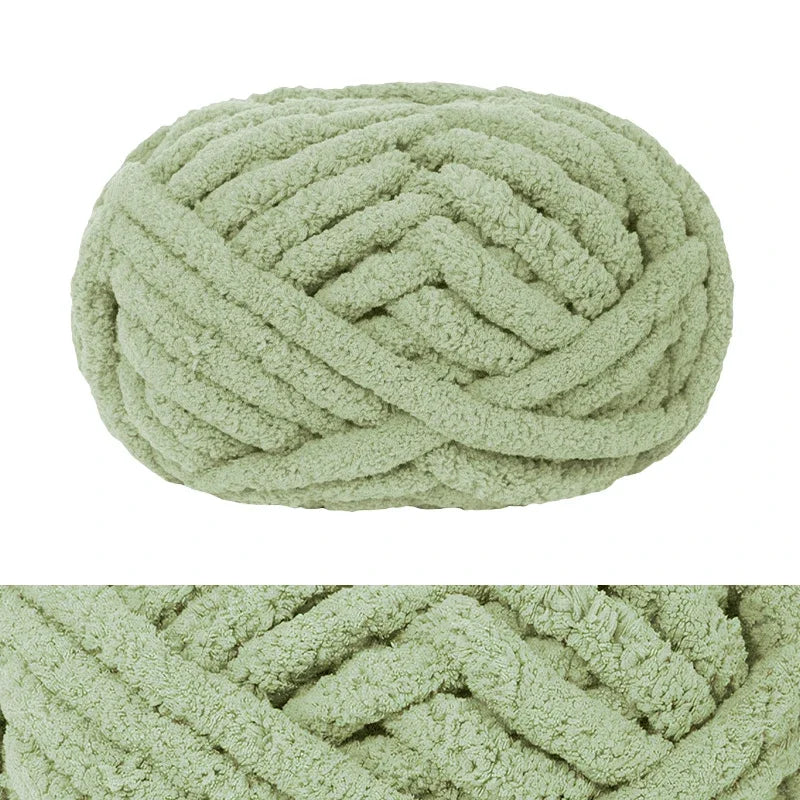 A ball of light green chunky chenille yarn used for hand knitting and crochet