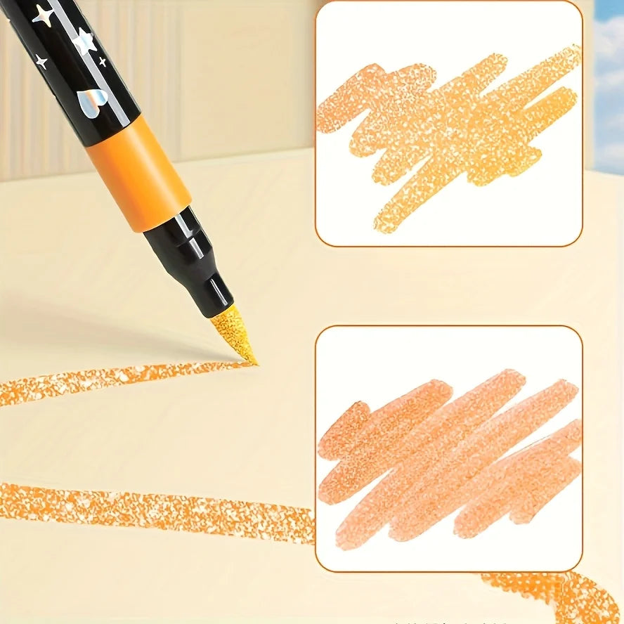 A close-up of an orange and black dual-ended glitter pen writing on a light surface, showing ink strokes.