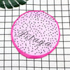 Pink fruit-design waterproof shower cap with a black speckled pattern on a white checkered background