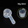 Clear plastic measuring cup with a long spout shown next to a zoomed-in view of the cup's markings
