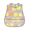 A light gray baby feeding bib with a pattern of sliced oranges and lemons.